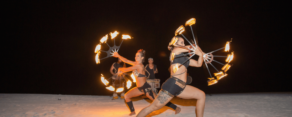 two fire dancers performing in cabo san lucas