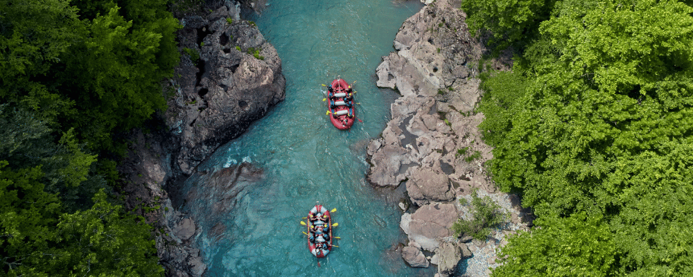 two rafts kayaking through the river