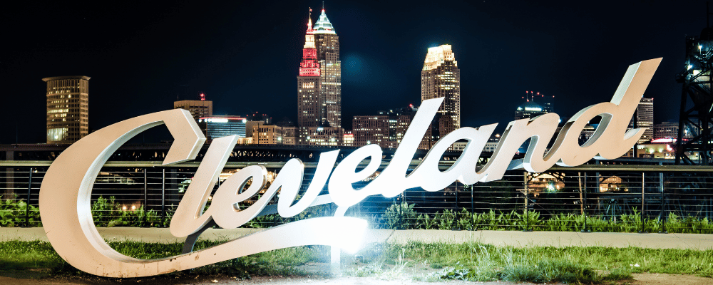 Cleveland sign with Cleveland hotels and skyline in background