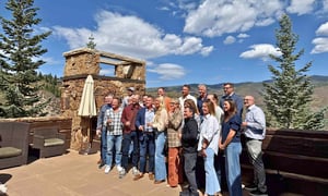 group of franchise owners at an event in the mountains