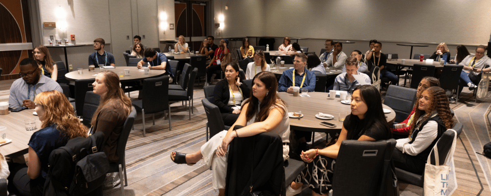 group of attendees watching a conference