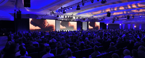 group of conference attendees watching a presentation