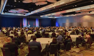 group of event attendees watching a corporate conference
