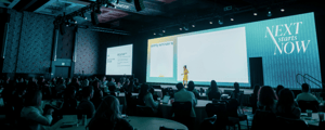 a general session room filled with a speaker