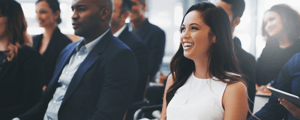Woman listening to conference presentation