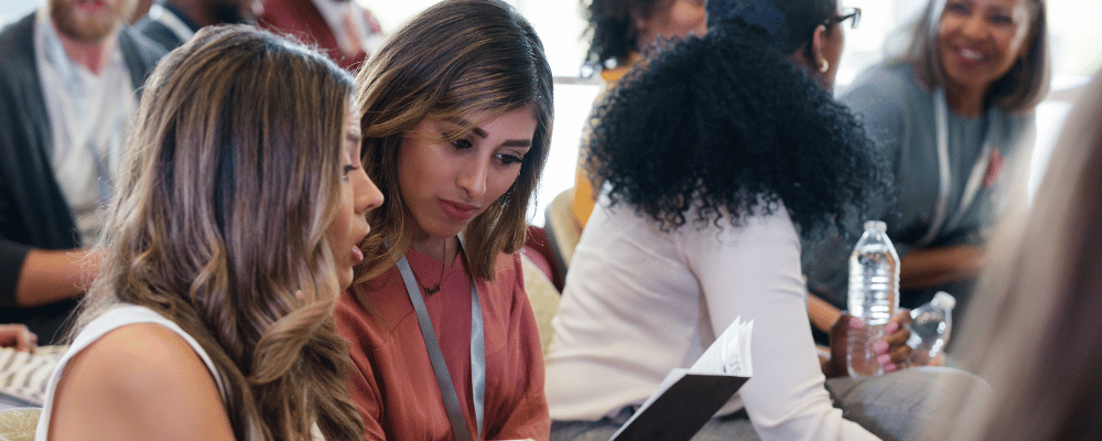 conference attendees looking at agenda