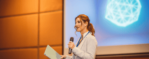 keynote speaker giving presentation at a conference