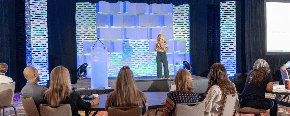 speaker giving a presentation at a corporate conference