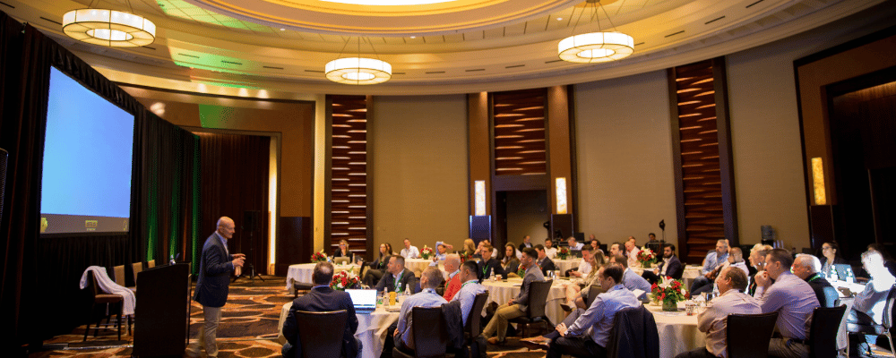 speaker giving a presentation at a corporate conference