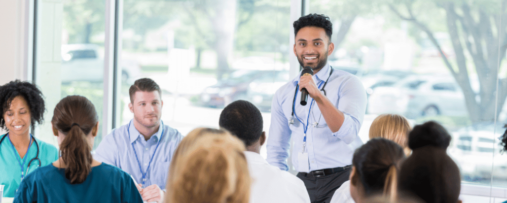 man giving a presentation during a corporate conference