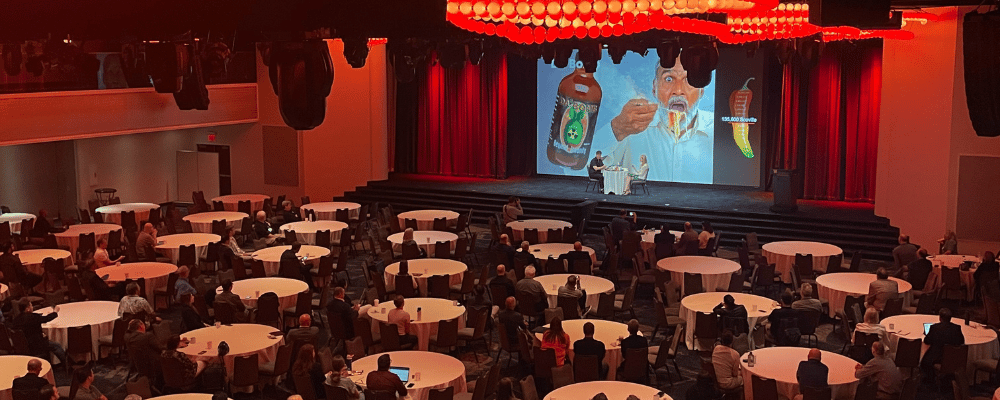 hot sauce game on stage during a corporate conference