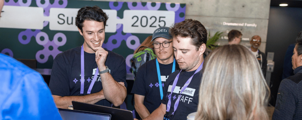 event attendees around a computer