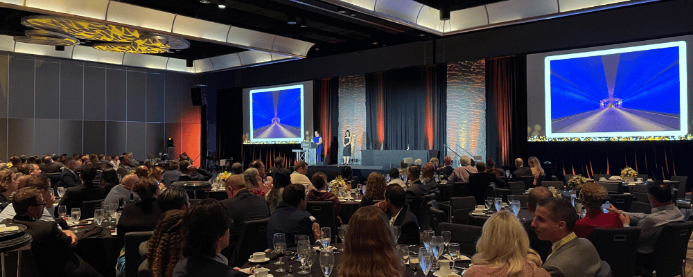 group of event attendees watching a conference