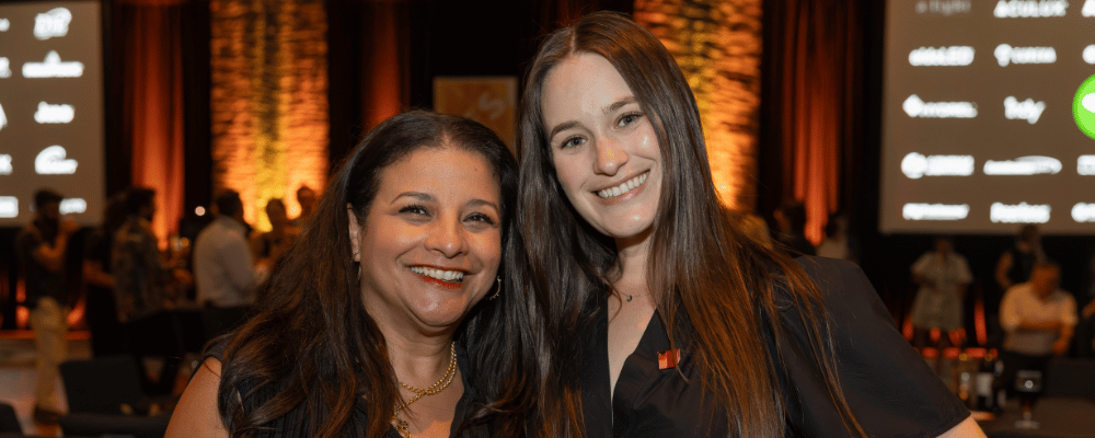 two event managers at a conference