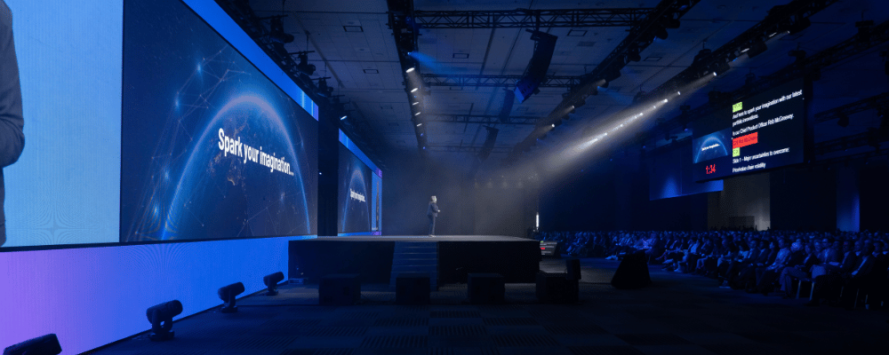 group of attendees watching a conference