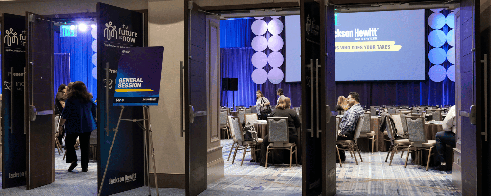 attendees walking into general session