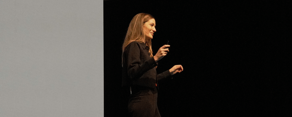 speaker presenting during a corporate event