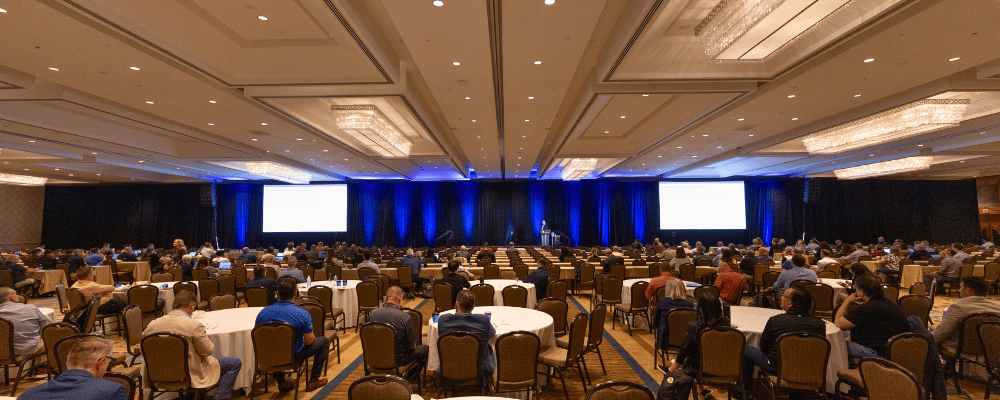 group of event attendees watching a corporate conference