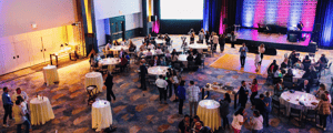 group of attendees networking at a corporate event venue