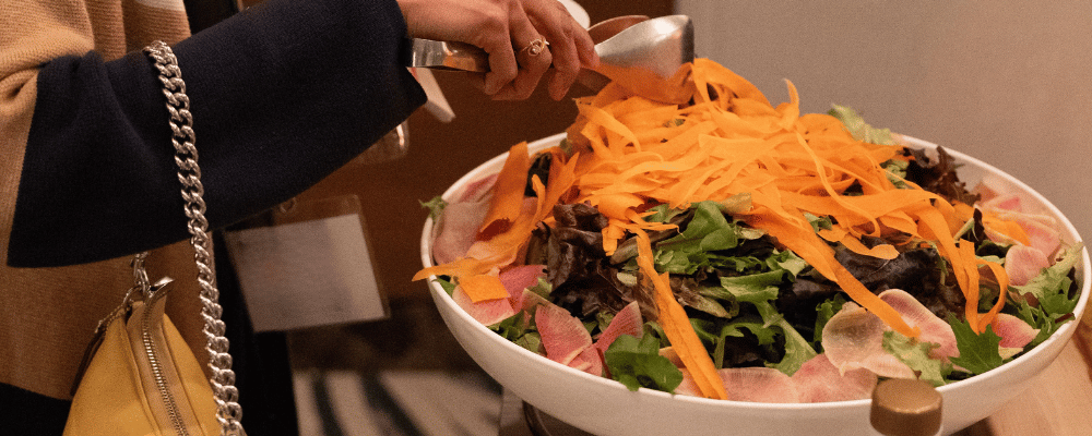 event attendee at the salad buffet