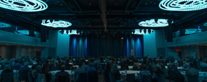 group of event attendees watching a corporate conference
