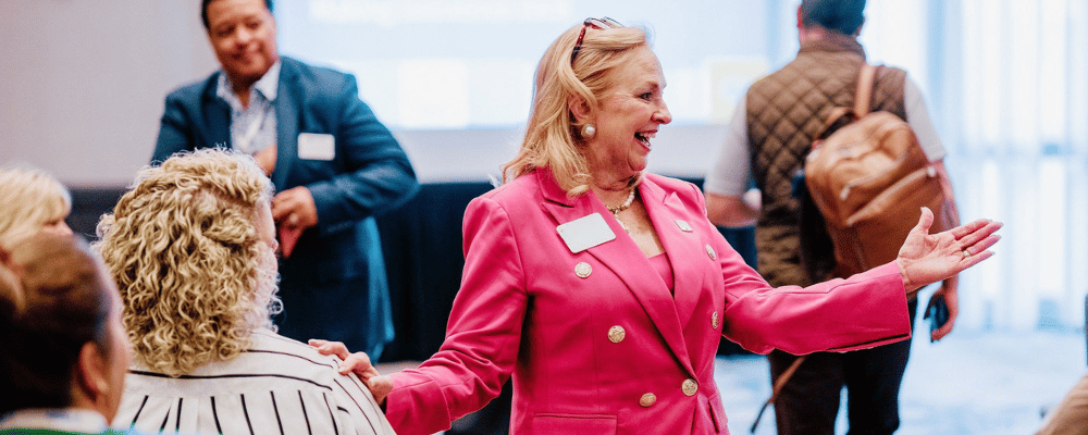 event attendee smiling during a corporate meeting event