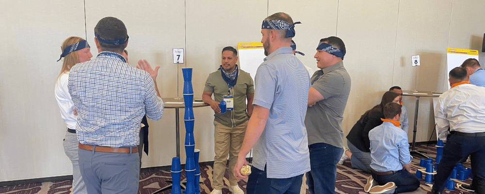 group of attendees doing corporate team building 