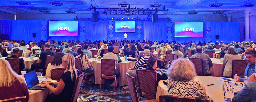 group of attendees watching a corporate conference