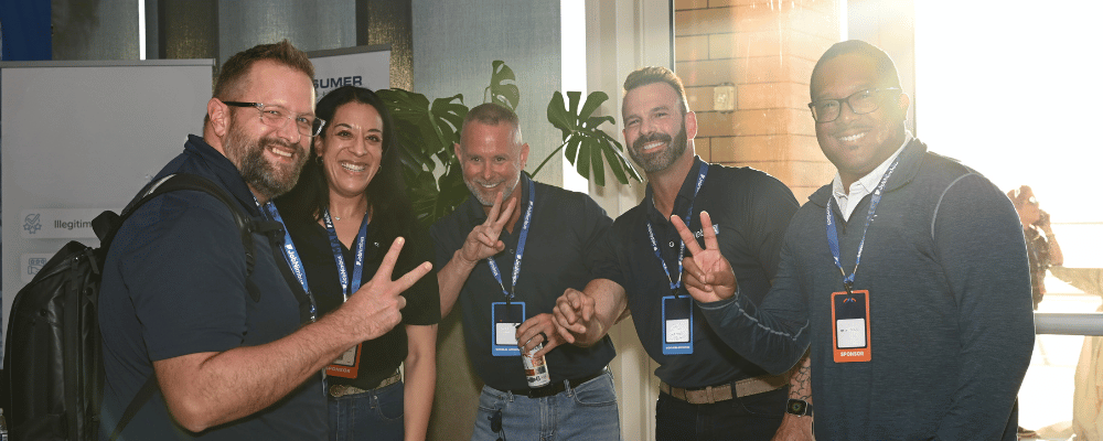 group of attendees smiling at the camera