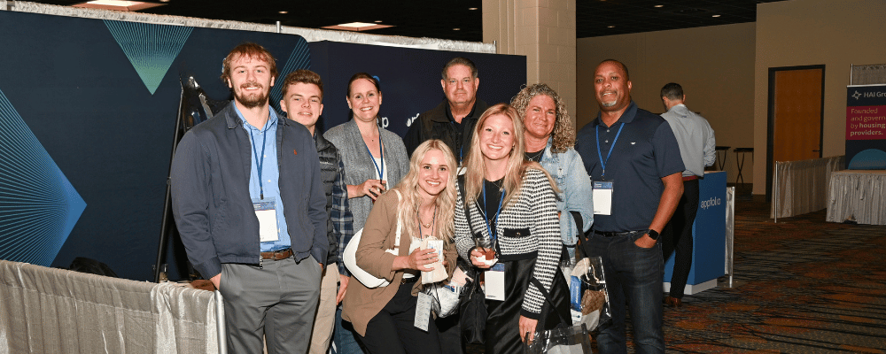 group of attendees smiling at a conference