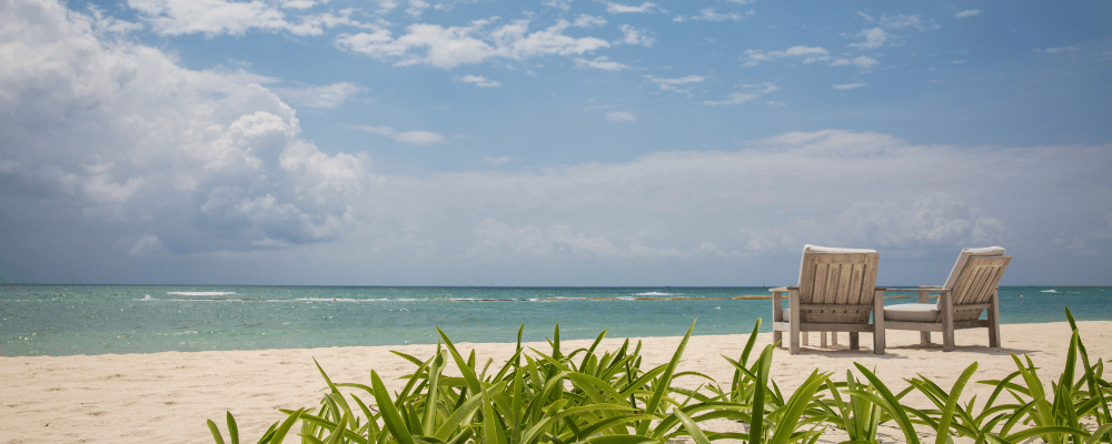 sales incentive trip location on the beach with two chairs facing the ocean