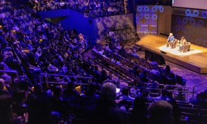 group of attendees watching a corporate conference