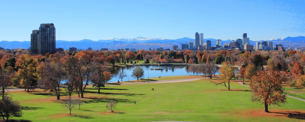 Park in Denver overlooking skyline and mountains in background