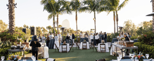 dinner and cocktail hour of attendees standing during a corporate incentive trip