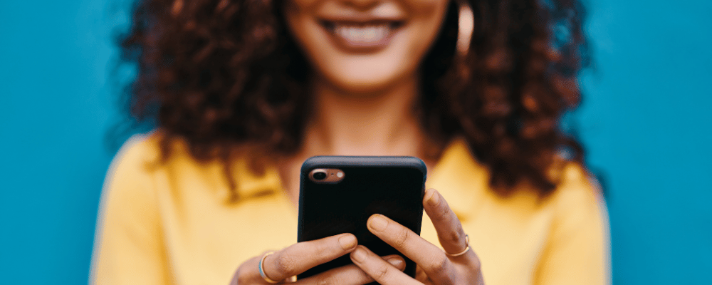 woman checking email invite on her phone