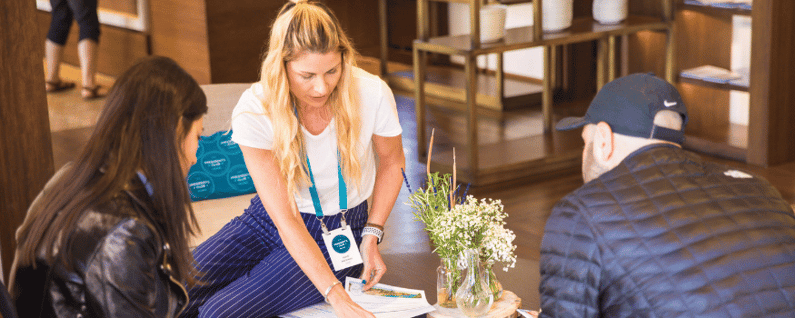 employee explaining interary to attendees