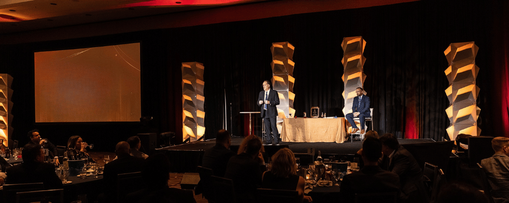 man giving presentation during a conference