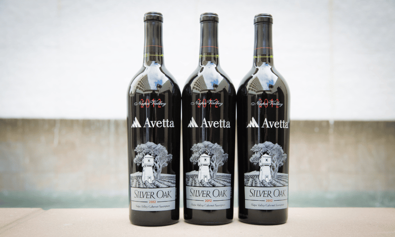 three custom wine bottles featuring corporate logo