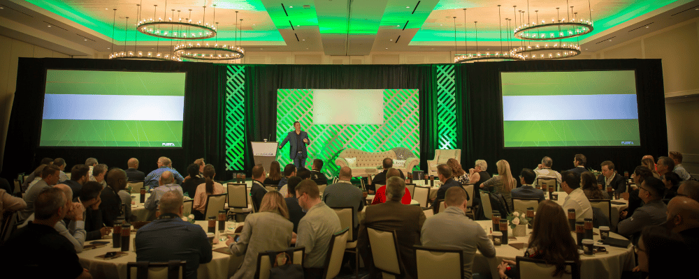 group of attendees watching an corporate presentation at an event