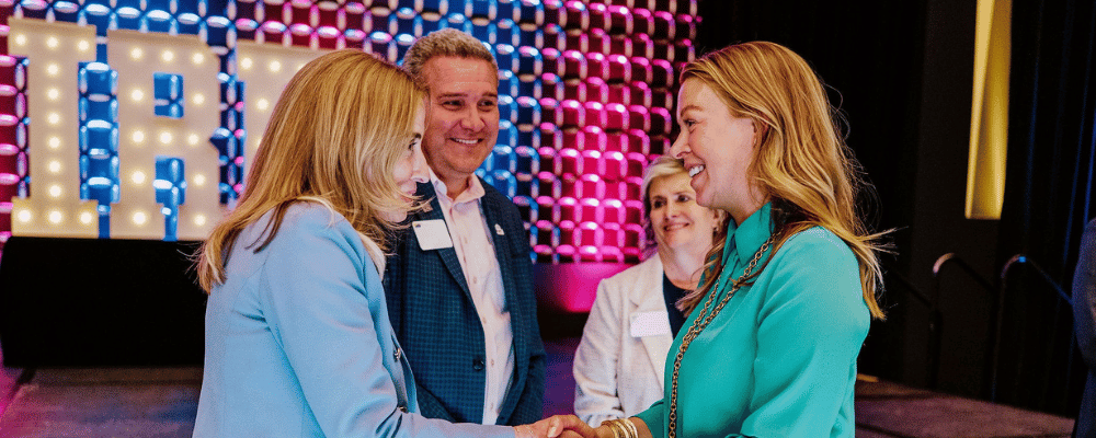attendees networking during a conference