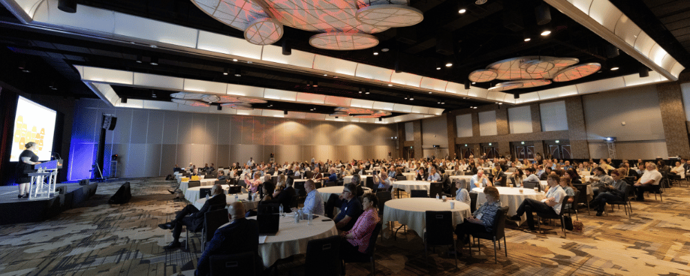 group of event attendees watching a speaker