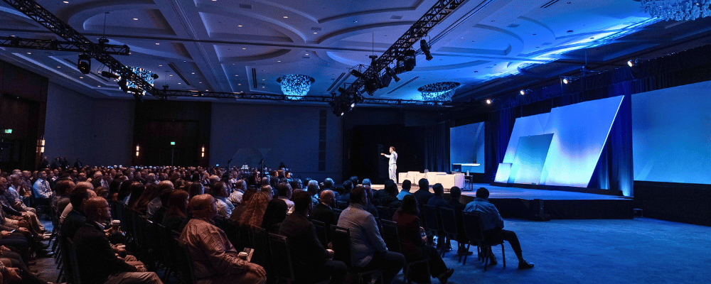 speaker giving a presentation during a conference