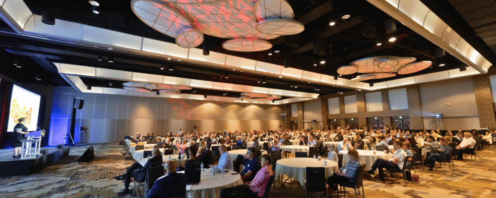 speaker giving a presentation during a conference