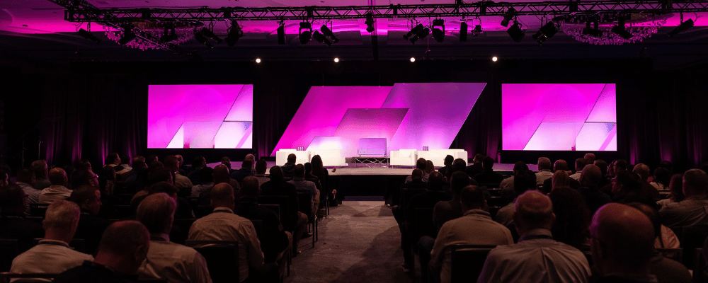 speaker giving a presentation during a conference
