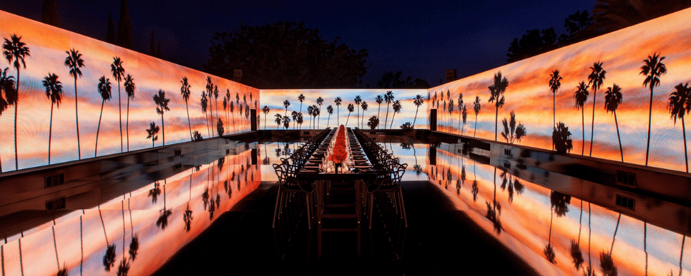 event production partner set-up table with palm trees