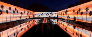 corporate event dinner with production displaying palm trees