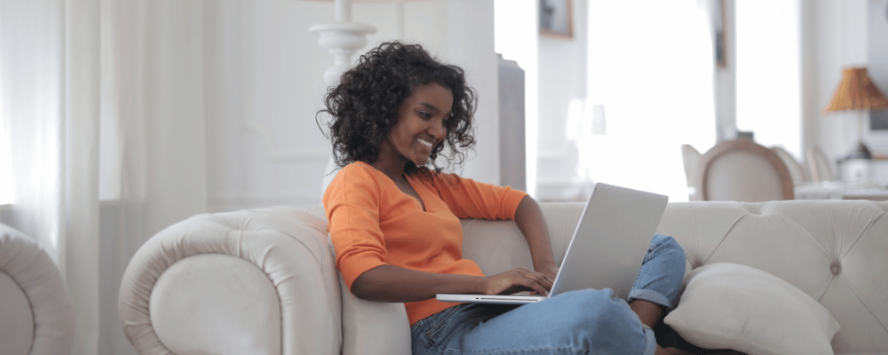 woman checking event discounts on her laptop