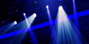 event production at a conference shining lights