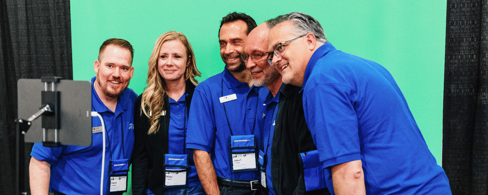 group of event attendees posing for a photo