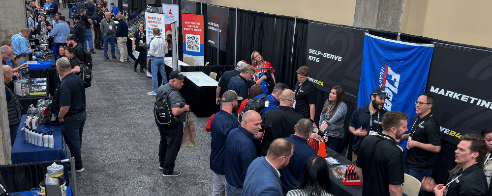 group of event attendees networking on a expo floor tradeshow